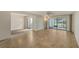 Open living space with tile floors and access to multiple rooms at 5152 Marsh Field Ln # 117, Sarasota, FL 34235