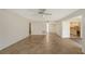 Open concept living area with tile flooring and kitchen view at 5152 Marsh Field Ln # 117, Sarasota, FL 34235