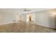 Open living area with tile floors, ceiling fan and kitchen access at 5152 Marsh Field Ln # 117, Sarasota, FL 34235