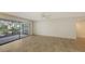 Bright living area featuring tile floors and access to a private patio at 5152 Marsh Field Ln # 117, Sarasota, FL 34235