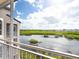 Balcony offering tranquil water views at 5440 Eagles Point Cir # 405, Sarasota, FL 34231