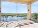 Spacious screened balcony overlooking water and lush landscape at 5440 Eagles Point Cir # 405, Sarasota, FL 34231
