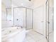 Bathroom with shower, bathtub, and tile flooring at 5440 Eagles Point Cir # 405, Sarasota, FL 34231