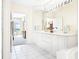 Bathroom features double vanity, soaking tub, and walk-in shower at 5440 Eagles Point Cir # 405, Sarasota, FL 34231