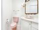 Pink bathroom with toilet and vanity at 5440 Eagles Point Cir # 405, Sarasota, FL 34231