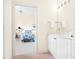 Bathroom with vanity and a view of bedroom at 5440 Eagles Point Cir # 405, Sarasota, FL 34231