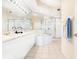 Elegant bathroom with double sinks, a large soaking tub and shower at 5440 Eagles Point Cir # 405, Sarasota, FL 34231