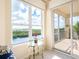 Bedroom with stunning water views and access to a private balcony at 5440 Eagles Point Cir # 405, Sarasota, FL 34231
