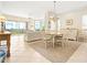 Charming dining room with chandelier and views at 5440 Eagles Point Cir # 405, Sarasota, FL 34231