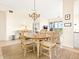 Bright dining area with wooden table and chairs at 5440 Eagles Point Cir # 405, Sarasota, FL 34231