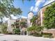 Attractive building exterior with landscaping and courtyard at 5440 Eagles Point Cir # 405, Sarasota, FL 34231