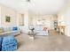 Open concept living area with adjacent kitchen at 5440 Eagles Point Cir # 405, Sarasota, FL 34231