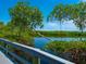 Serene waterfront view from a relaxing boardwalk at 5440 Eagles Point Cir # 405, Sarasota, FL 34231