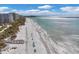 Aerial view of beach, shoreline, and condo buildings at 545 Sanctuary Dr # A803, Longboat Key, FL 34228
