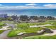 Aerial view of condo complex situated on a golf course near the ocean at 545 Sanctuary Dr # A803, Longboat Key, FL 34228