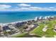 Aerial view of luxurious beachfront condos and golf course at 545 Sanctuary Dr # A803, Longboat Key, FL 34228