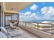 Spacious condo balcony with ocean views, hammock, and lounge chairs at 545 Sanctuary Dr # A803, Longboat Key, FL 34228