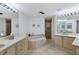 Spa-like bathroom with a large soaking tub and double vanity, offering luxury at 545 Sanctuary Dr # A803, Longboat Key, FL 34228