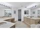 Large bathroom with double vanity, soaking tub, and plenty of storage at 545 Sanctuary Dr # A803, Longboat Key, FL 34228