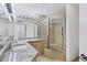 Bathroom with granite countertop and walk-in shower at 545 Sanctuary Dr # A803, Longboat Key, FL 34228