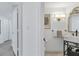 Small powder room with marble vanity at 545 Sanctuary Dr # A803, Longboat Key, FL 34228