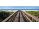 Convenient boardwalk to pristine beach with lounge chairs at 545 Sanctuary Dr # A803, Longboat Key, FL 34228