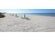 Beachfront property with lounge chairs and umbrellas at 545 Sanctuary Dr # A803, Longboat Key, FL 34228