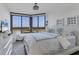 Bright bedroom with water views and stylish decor at 545 Sanctuary Dr # A803, Longboat Key, FL 34228