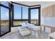Bright breakfast nook with stunning water views, perfect for morning coffee at 545 Sanctuary Dr # A803, Longboat Key, FL 34228