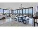 Open concept dining area with rustic table and seating at 545 Sanctuary Dr # A803, Longboat Key, FL 34228