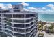 Modern high-rise condo building with oceanfront balconies at 545 Sanctuary Dr # A803, Longboat Key, FL 34228