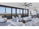 Bright living room with water views and stylish furnishings at 545 Sanctuary Dr # A803, Longboat Key, FL 34228