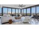 Living room with panoramic views and comfortable seating at 545 Sanctuary Dr # A803, Longboat Key, FL 34228