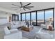 Living area with floor to ceiling windows and ocean view at 545 Sanctuary Dr # A803, Longboat Key, FL 34228
