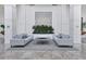 Upscale condo lobby with modern furniture and tranquil plants at 545 Sanctuary Dr # A803, Longboat Key, FL 34228