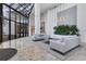 Bright condo lobby featuring modern sofas and large windows at 545 Sanctuary Dr # A803, Longboat Key, FL 34228