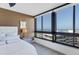 Main bedroom with stunning water views and large windows, offering ample natural light at 545 Sanctuary Dr # A803, Longboat Key, FL 34228