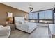 Relaxing main bedroom with large windows and water views, featuring a plush bed at 545 Sanctuary Dr # A803, Longboat Key, FL 34228