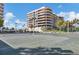 Well-maintained tennis court with building in background at 545 Sanctuary Dr # A803, Longboat Key, FL 34228