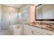 Bathroom with a shower, bathtub, and granite countertop at 5554 New Covington Dr, Sarasota, FL 34233