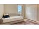 Bedroom with daybed, built-in closet, and area rug at 5554 New Covington Dr, Sarasota, FL 34233