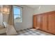 Bright bedroom featuring built-in wooden cabinetry and a piano at 5554 New Covington Dr, Sarasota, FL 34233