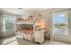 Bedroom with a bunk bed, desk, and water views at 5554 New Covington Dr, Sarasota, FL 34233