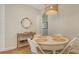 Charming dining area with round table and wicker chairs at 5554 New Covington Dr, Sarasota, FL 34233