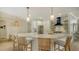 Modern kitchen with white cabinets, quartz countertops, and high-end appliances at 5554 New Covington Dr, Sarasota, FL 34233