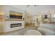 Open concept living room with kitchen and fireplace at 5554 New Covington Dr, Sarasota, FL 34233