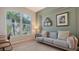 Home office with comfortable sofa and large window at 5554 New Covington Dr, Sarasota, FL 34233