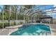 Inviting pool area with spa and screened enclosure at 5554 New Covington Dr, Sarasota, FL 34233