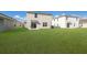 Spacious backyard with two homes and a lush lawn at 5846 Silver Moonlight Dr, Palmetto, FL 34221