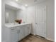 Bathroom with double vanity and marble countertop at 5846 Silver Moonlight Dr, Palmetto, FL 34221